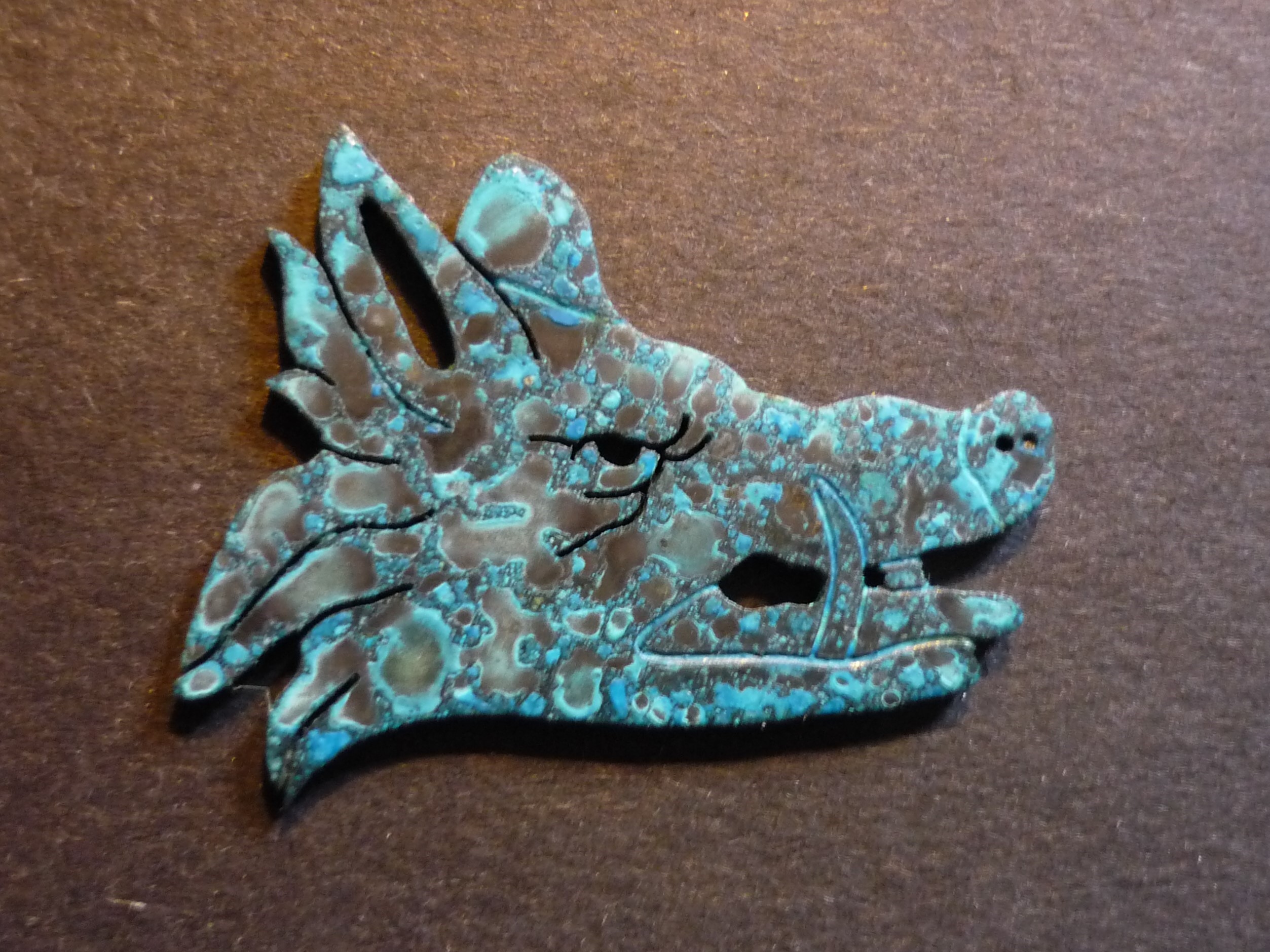 brass patina boar's head engraved